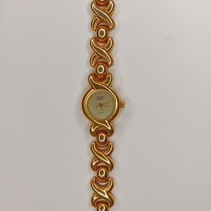 Vintage 80s Gitano 2000s quartz crescent abstract gold tone watch